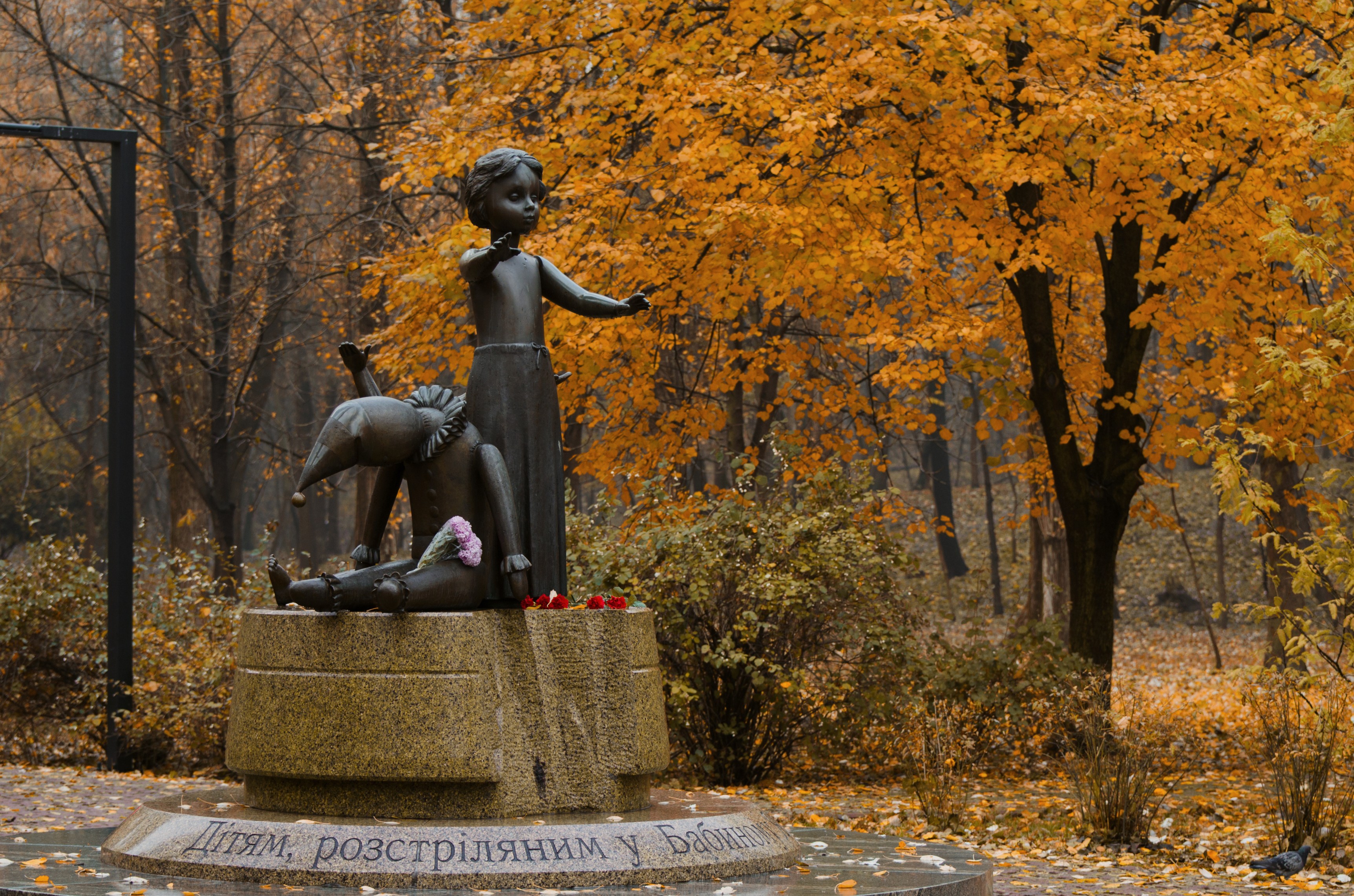 Kyiv Ukraine - November 09, 2019. Granite Broken Doll and Toys. A symbolic monument to children executed in Babi Yar, the place of massacres carried out by German forces during World War II.