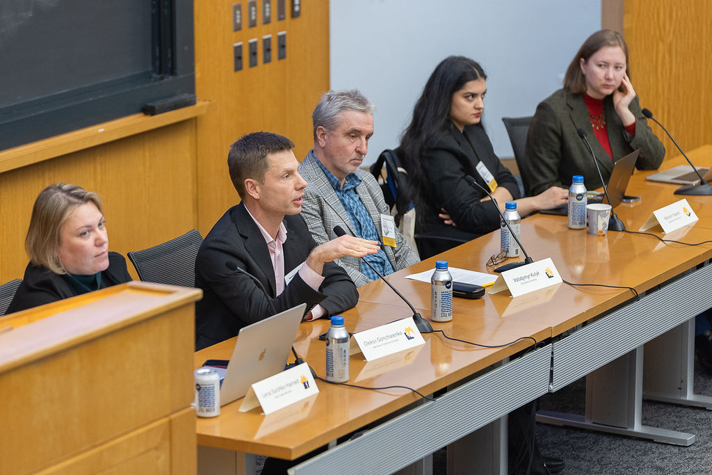 Still from the 4th Panel of the TCUP conference. Ukrainian MP Oleksii Goncharenko speaks, while moderator Lena Surzhko-Harned, and speakers Volodymyr Kulyk, Mariam Naiem, and Olga Skrypnyk (left to right) listen on.