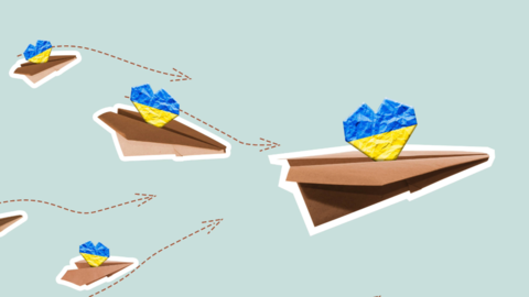 Paper planes fly carrying yellow and blue hearts