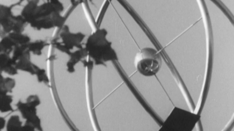 A still from the film "Morning of the Atomohrad" (1974, directed by Volodymyr Heorhiienko) depicting a sculpture of an atom