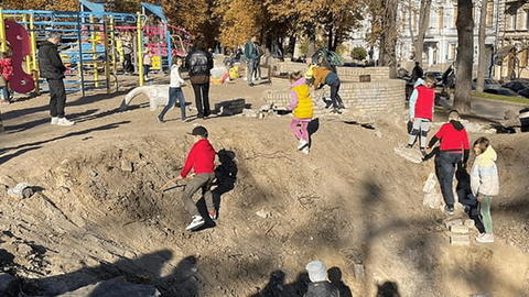 children and adults in playground