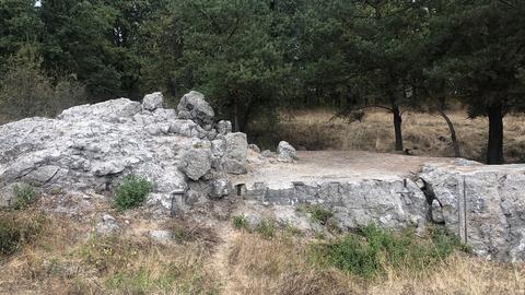 A destroyed bunker, with iron reinforcements visible