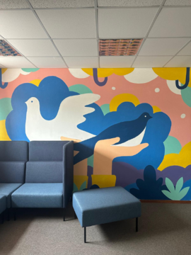 Student-painted art in a hallway at Freedom School—featuring a peace dove and a swallow, the Estonian national bird