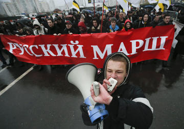Russian nationalists rally recently in Moscow, venting against the migrants they accuse of increasing the crime rate and taking their jobs. (Pavel Golovkin / The Associated Press)