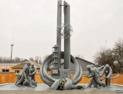A monument in front of a fire station to the 32 firefighters who died responding to the explosion at Reactor No. 4, Chernobyl, Ukraine, March 19, 2014. (Steve Herman/VOA)