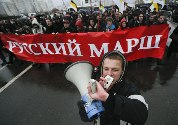 Russian nationalists rally recently in Moscow, venting against the migrants they accuse of increasing the crime rate and taking their jobs. (Pavel Golovkin / The Associated Press)