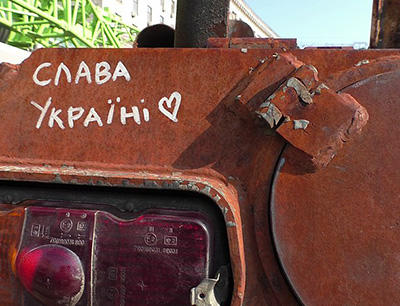 Slava Ukraini written on rusty military equipment