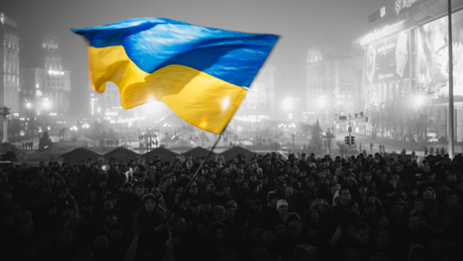 Ukraine flag flying over crowd