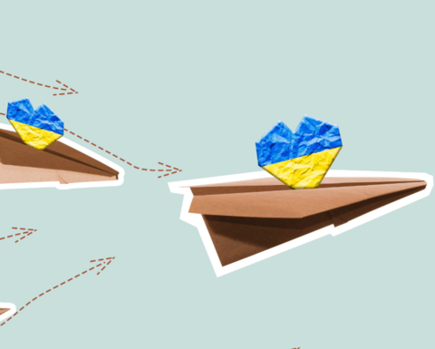 Paper planes fly carrying yellow and blue hearts