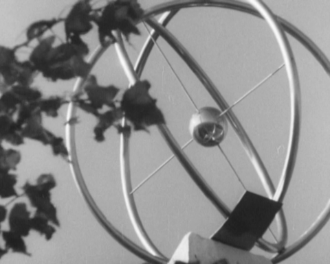 A still from the film "Morning of the Atomohrad" (1974, directed by Volodymyr Heorhiienko) depicting a sculpture of an atom